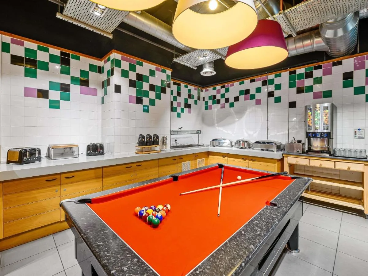 a kitchen with a pool table with balls on it at ibis Styles Glasgow Centre George Square in Glasgow