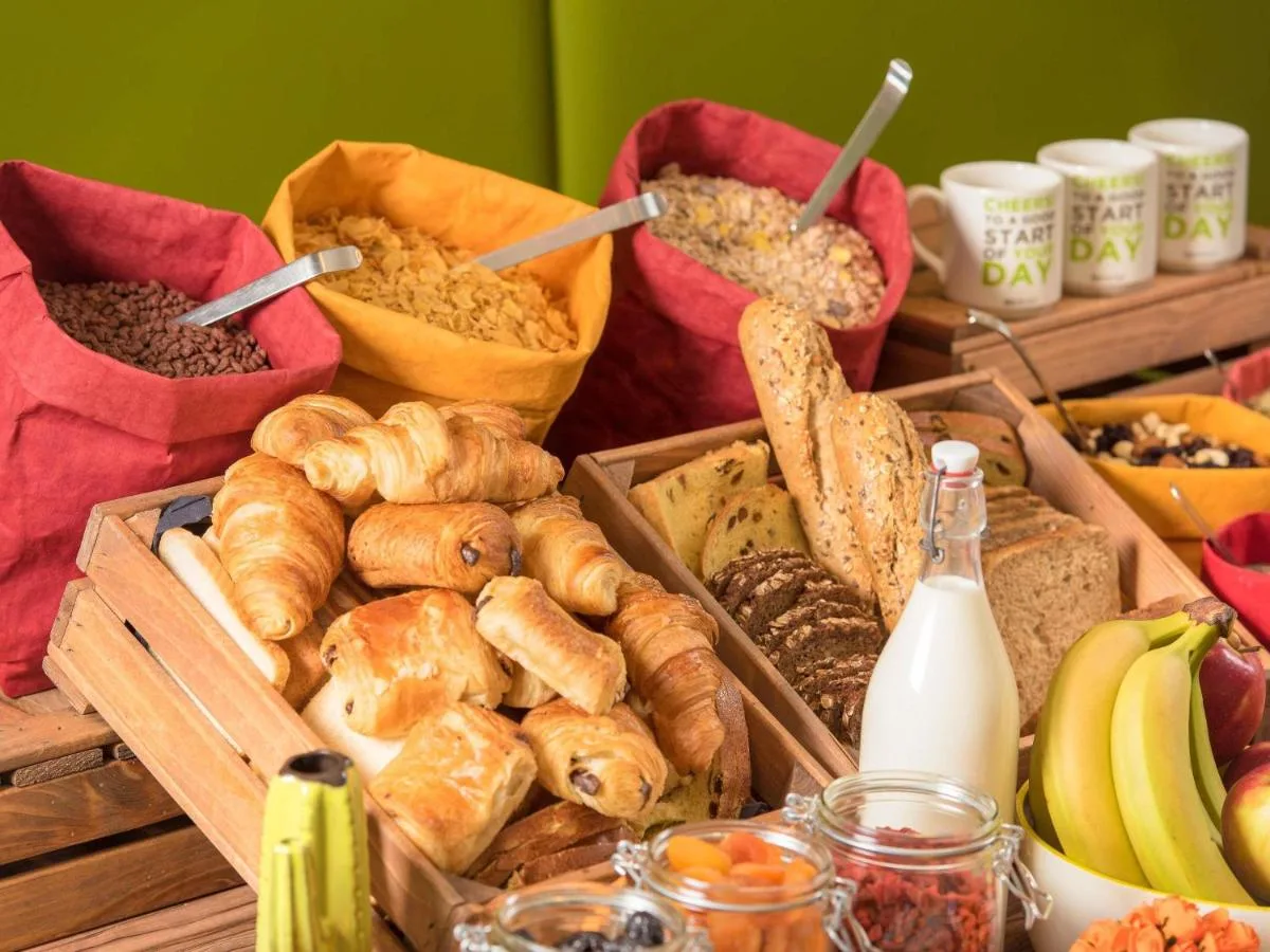 a table topped with lots of different types of bread at ibis Styles Glasgow Centre George Square in Glasgow